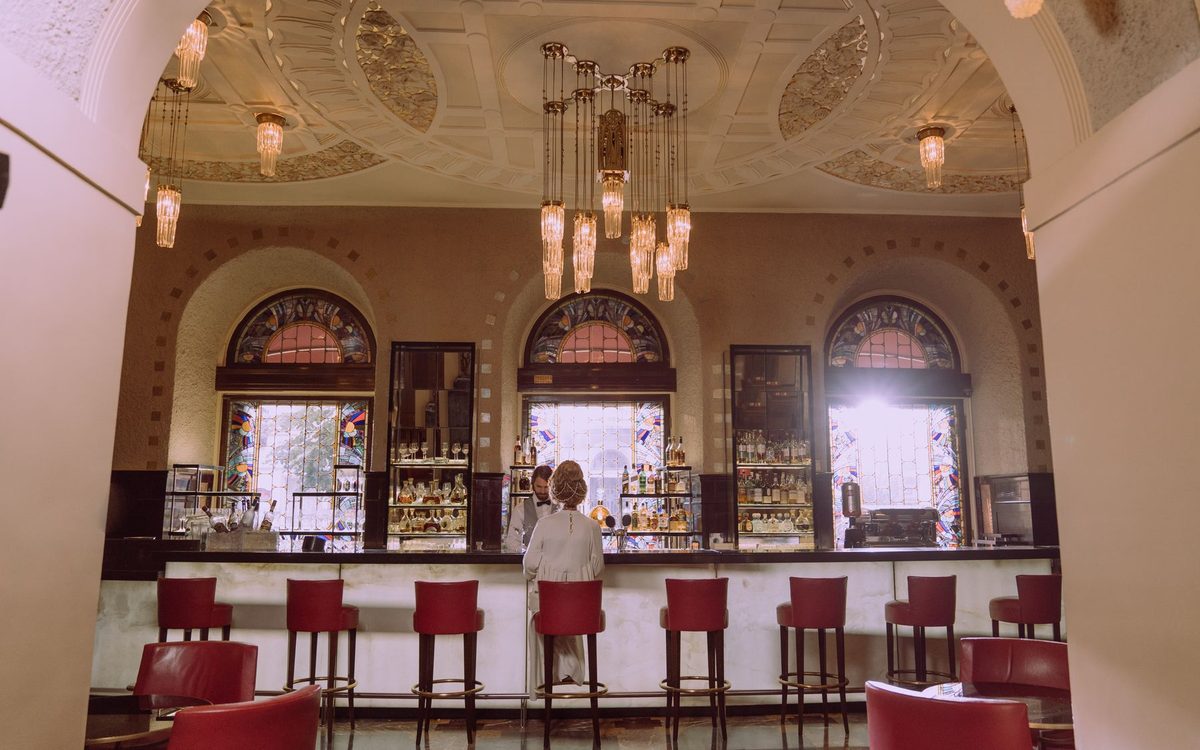 Hotel bar with crystal chandeliers and stained glass windows